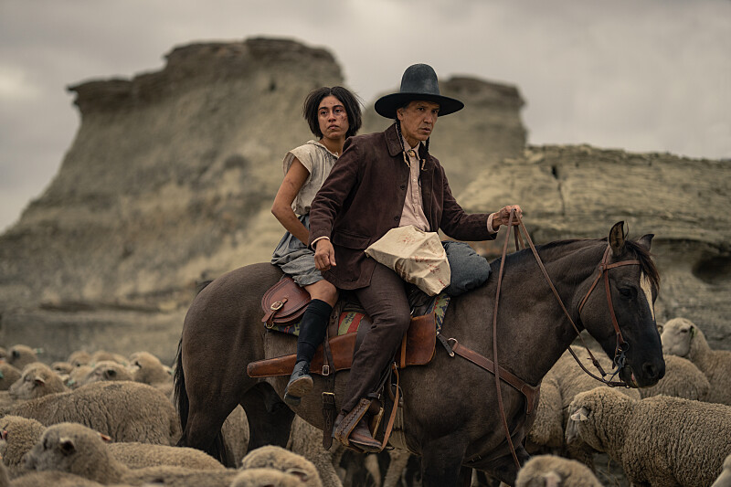 Aminah Nieves as Teonna and Michael Greyeyes as Hank of the Paramount+ series 1923. Photo Cr: Christopher Saunders/Paramount+ © 2022 Viacom International Inc. All Rights Reserved.
