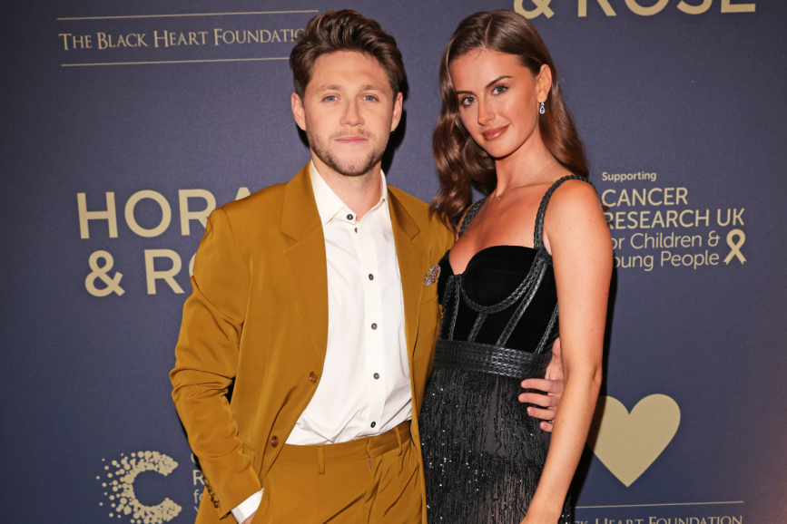 WATFORD, ENGLAND - SEPTEMBER 03: Niall Horan and Mia Woolley attend the Horan & Rose Show: Modest! Golf co-founder Niall Horan and Justin Rose brought the world of music and sport together at The Grove, presenting an evening of entertainment to raise money for The Black Heart Foundation on September 03, 2021 in Watford, England.