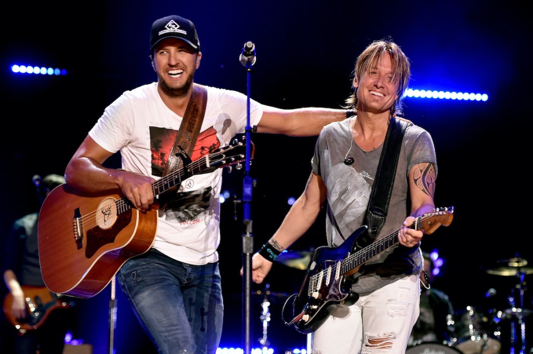 NASHVILLE, TN - JUNE 12: Singer-songwriters Luke Bryan (L) and Keith Urban perform onstage during 2016 CMA Festival - Day 4 at Nissan Stadium on June 12, 2016 in Nashville, Tennessee.