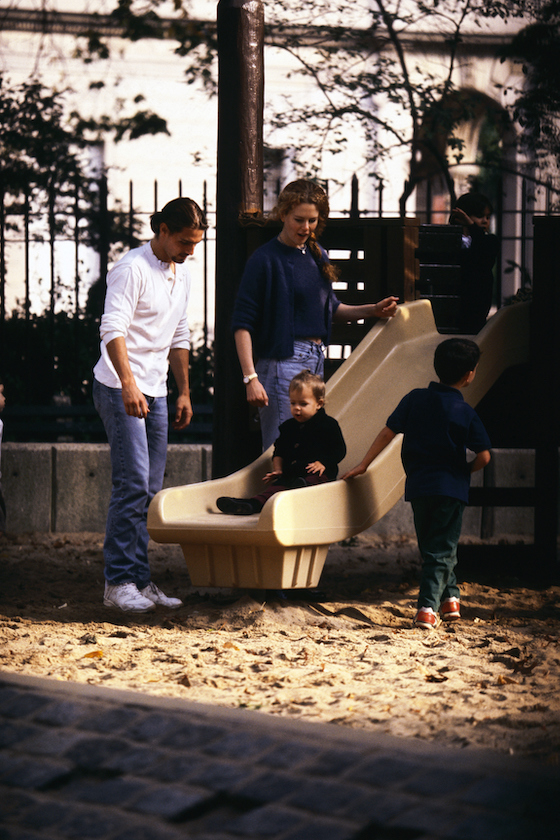 Nicole Kidman and Tom Cruise play with their daughter, Isabella Jane, on a slide in Central Park. 