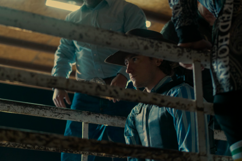 Lewis Pullman (Rhett Abbott) sits on a bull ready to enter the rodeo ring on 'Outer Range'