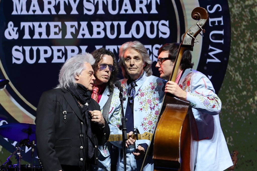Inductee Marty Stuart (L) performs with his Fabulous Superlatives Musical band during the 2022 Musicians Hall of Fame & Museum Concert and Induction Ceremony at Musicians Hall of Fame and Museum on November 22, 2022 in Nashville, Tennessee.