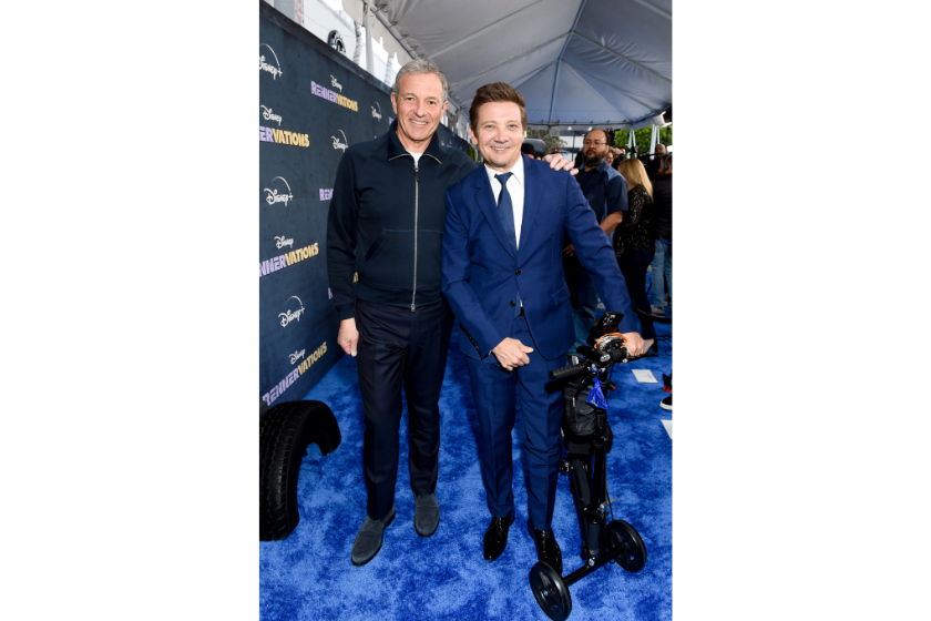 Disney CEO Bob Iger and Jeremy Renner. (Gilbert Flores/Variety via Getty Images)