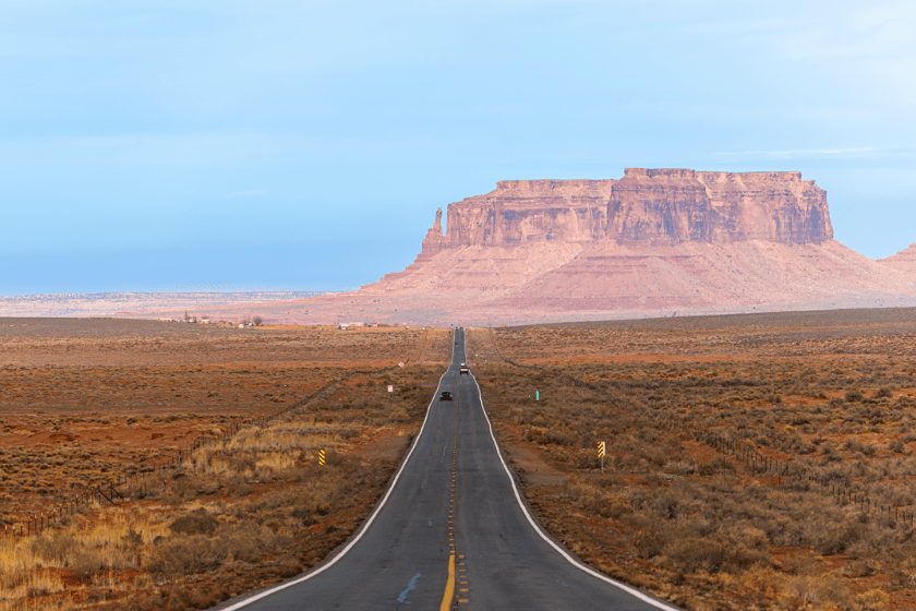 Car driving on a highway in Monument Valley, New Mexico, USA