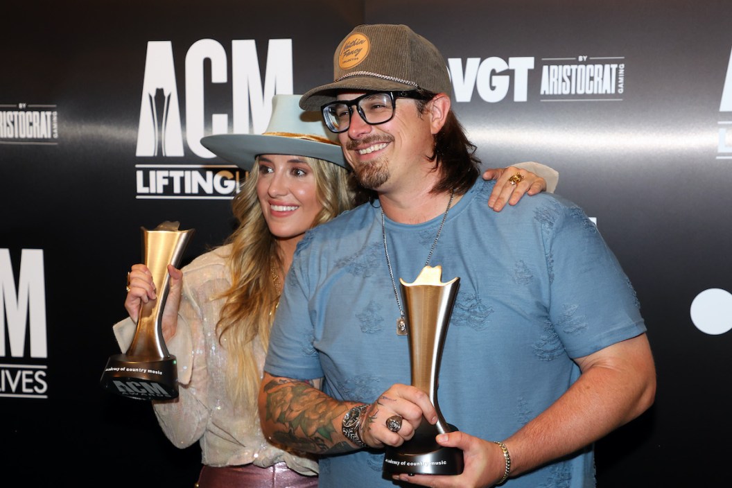 THE COLONY, TEXAS - MAY 10: Lainey Wilson and HARDY pose for a photo with ACM awards they were presented at a press conference after their performances at the 2023 ACM Lifting Lives Topgolf Tee-Off And Rock On Fundraiser at Topgolf on May 10, 2023 in The Colony, Texas.