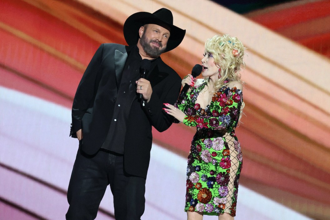 FRISCO, TEXAS - MAY 11: (L-R) Co-hosts Garth Brooks and Dolly Parton speak onstage during the 58th Academy Of Country Music Awards at The Ford Center at The Star on May 11, 2023 in Frisco, Texas.