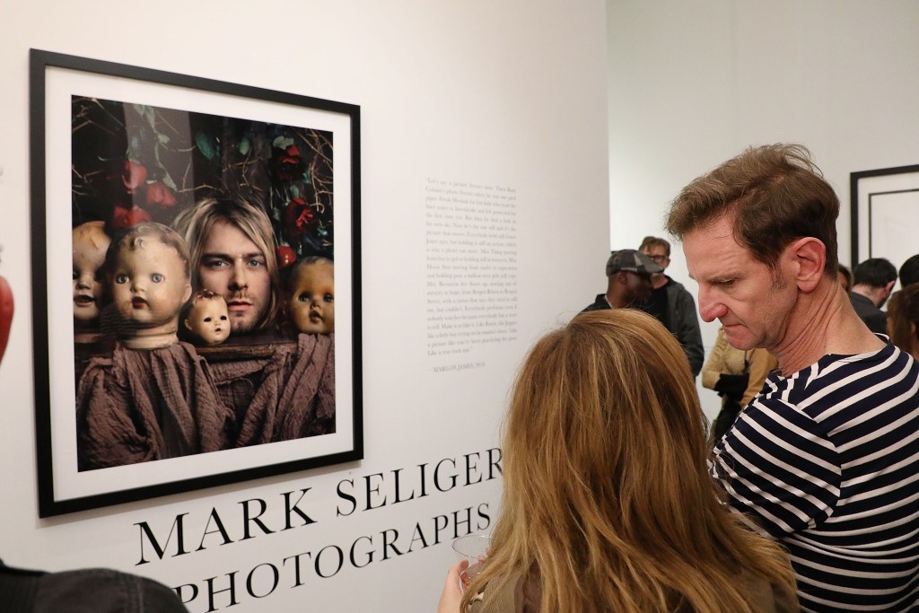 Photographer Mark Seliger talks with guests during the opening reception of "Mark Seliger Photographs" at Chase Contemporary Galleries on May 17, 2018 in New York City.
