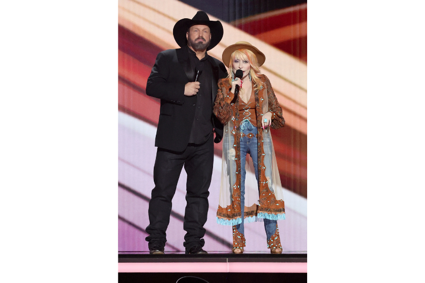 Garth Brooks and Dolly Parton speak onstage during the 58th Academy Of Country Music Awards at The Ford Center at The Star on May 11, 2023 in Frisco, Texas