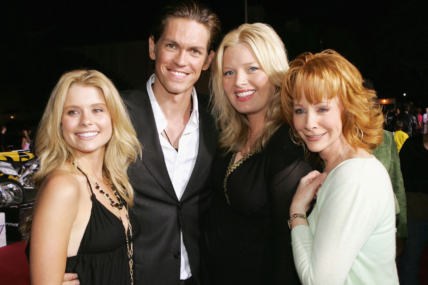 Actors Joanna Garcia, Steve Howey, Melissa Peterman and Reba McEntire pose at the premiere of Twentieth Century Fox' s "Supercross: The Movie" at the Wadsworth Theater on August 15, 2005 in Los Angeles, California
