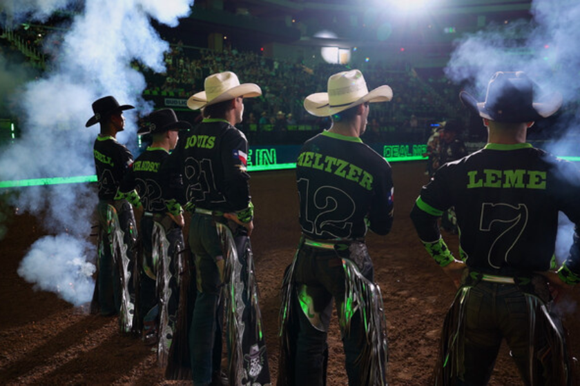 Cowboys lined up in arena on 'The Ride'