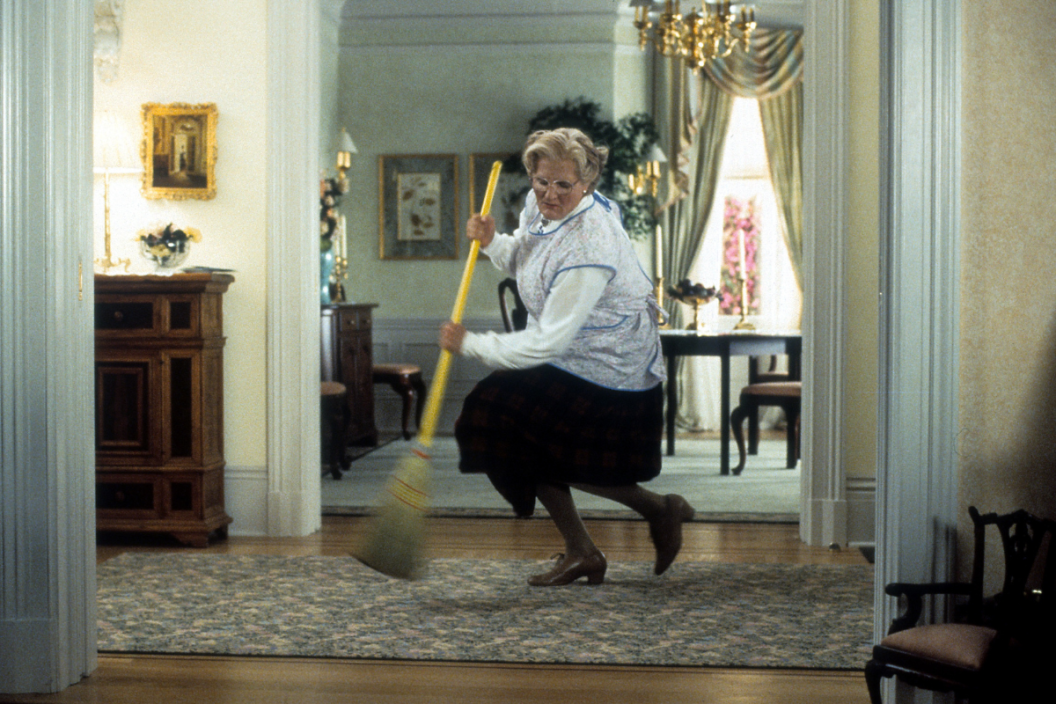 Robin Williams brooms in a scene from the film 'Mrs. Doubtfire', 1993