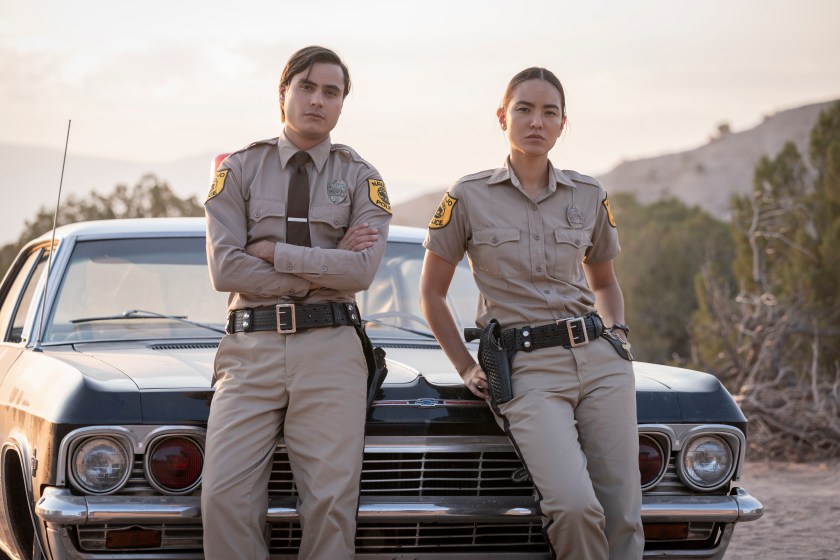 Kiowa Gordon as Jim Chee and Jessica Matten as Sgt. Bernadette Manuelito - Dark Winds _ Season 1, Episode 1 