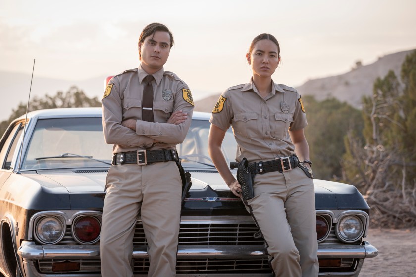 Kiowa Gordon as Jim Chee and Jessica Matten as Sgt. Bernadette Manuelito - Dark Winds _ Season 1, Episode 1
