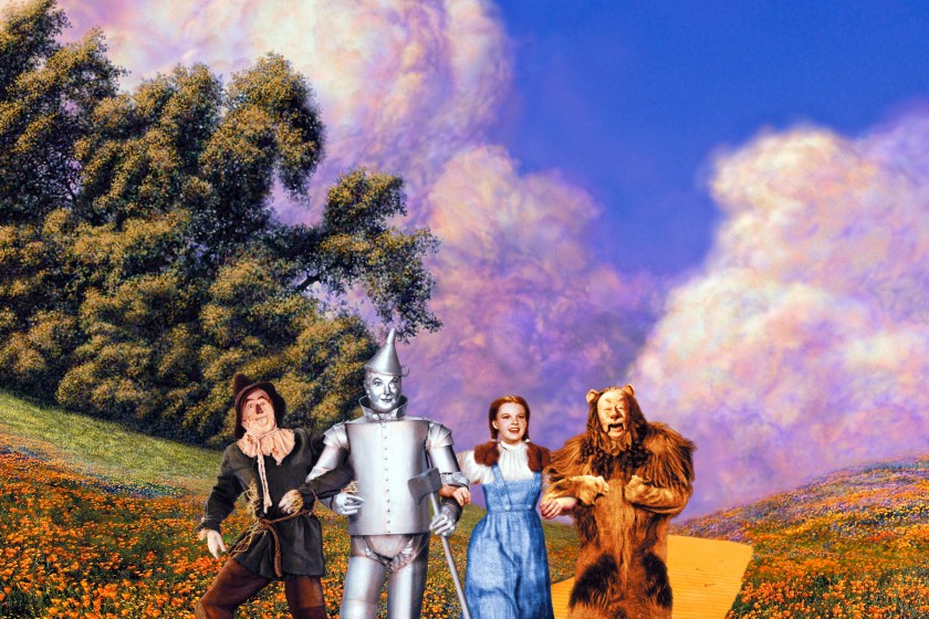 Ray Bolger (1904-1987), US actor, Jack Haley (1897-1979), US actor, Judy Garland (1922-1969), US actress and singer, and Bert Lahr (1895-1967), US actor and comedian, all in costume as they dance along the yellow brick road in a publicity still from the film, 'The Wizard of Oz', 1939. The musical, adapted from the novel by L Frank Baum (1856-1919) and directed by Victor Fleming (1889-1949), starred Bolger as the 'Scarecrow', Haley as the 'Tin Man', Garland as 'Dorthy Gale', and Lahr as the 'Cowardly Lion'.
