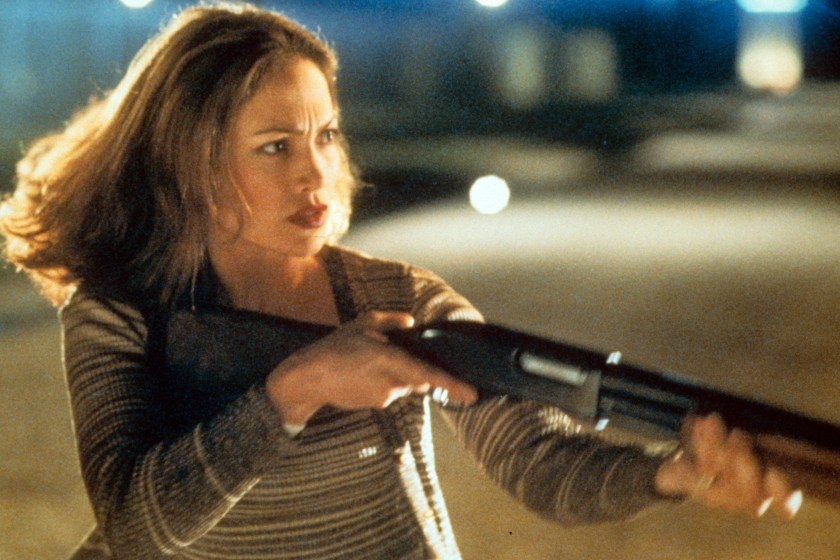 Jennifer Lopez holding rifle in a scene from the film 'Out Of Sight', 1998. 