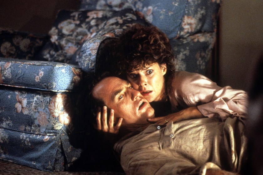 Craig T Nelson is held by JoBeth Williams in a scene from the film 'Poltergeist II: The Other Side', 1986