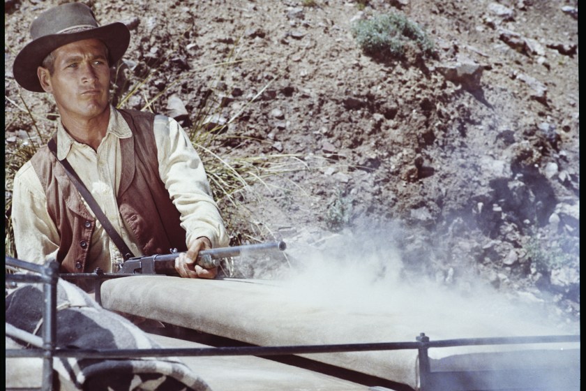 UNITED STATES - CIRCA 1967:  Paul Newman plays John "Hombre" Russell, the only hope of a group of stagecoach passengers set upon by bandits in the movie "Hombre", 1967. Newman is seen firing his rifle at the bandits.