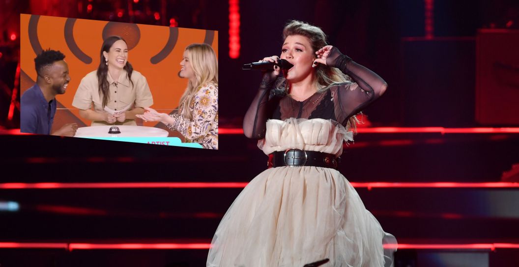 Kelly Clarkson performs on stage/ Screengrab via Artist vs. Fan Trivia