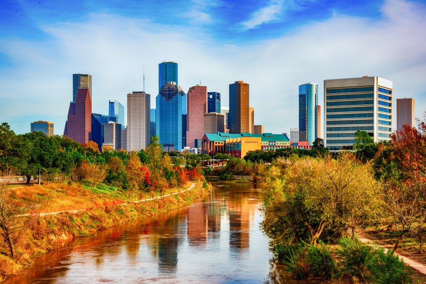 The skyline of downtown Houston, Texas shot from a bridge over the Buffalo Bayou within Eleanor Tinsley Park.