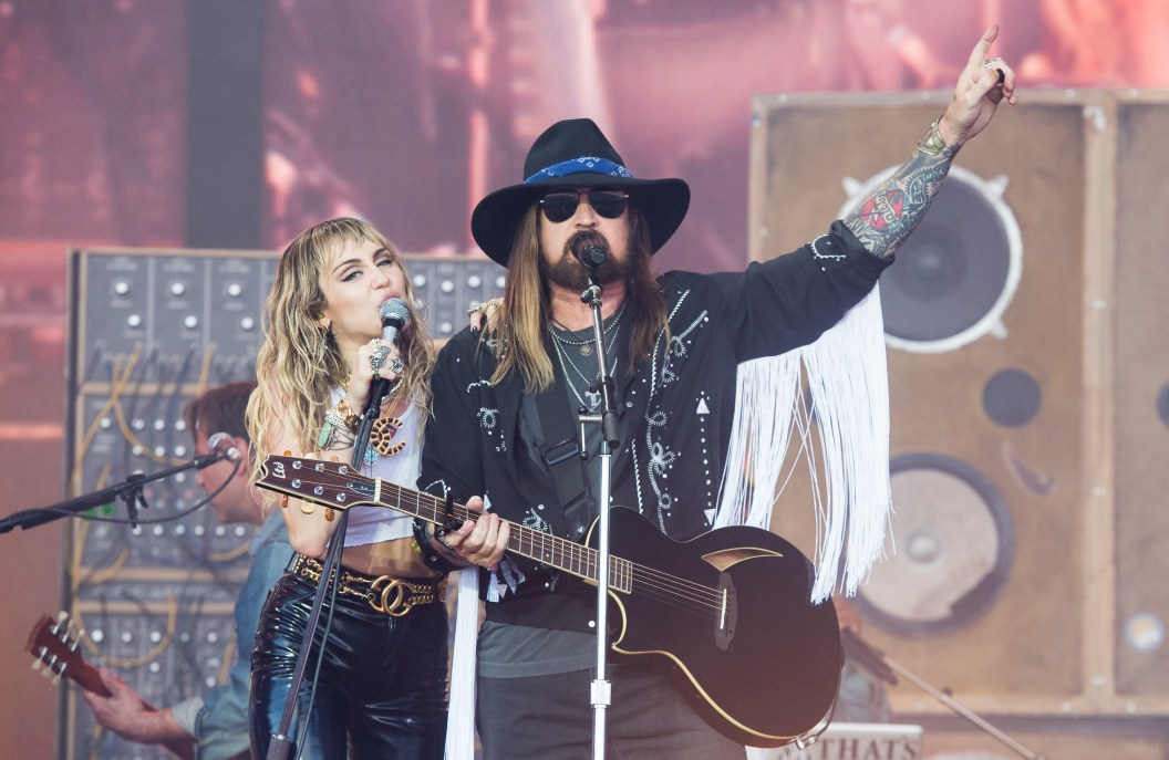 GLASTONBURY, ENGLAND - JUNE 30: Miley Cyrus and Billy Ray Cyrus perform on the Pyramid Stage during day five of Glastonbury Festival at Worthy Farm, Pilton on June 30, 2019 in Glastonbury, England.
