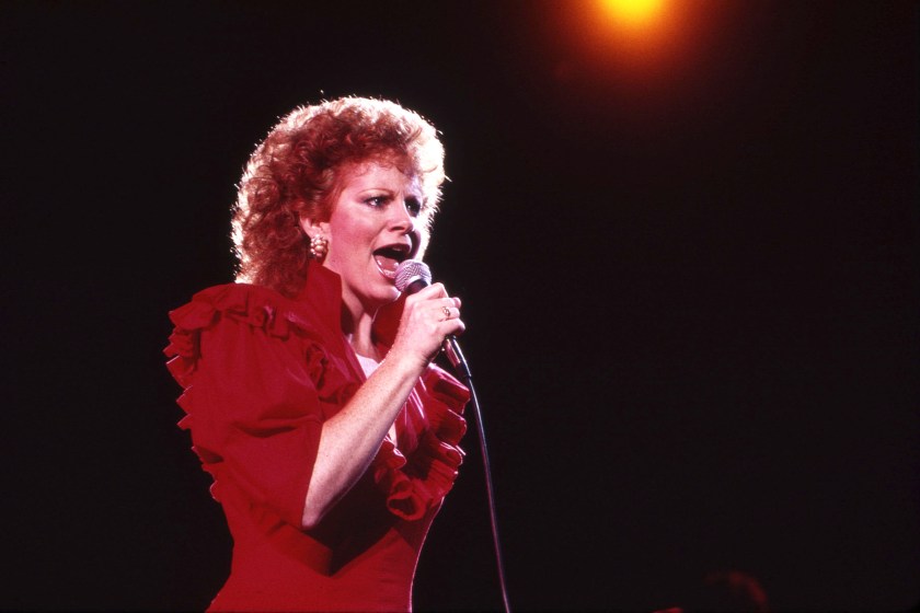 NASHVILLE -June 26: Country Music Singer Songwriter Reba McEntire receives a Music City News Award on June 26, 1987 in Nashville, Tennessee