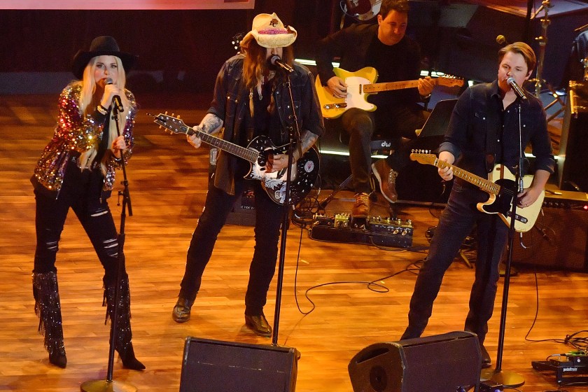 NASHVILLE, TENNESSEE - AUGUST 23: (L-R) FIREROSE, Billy Ray Cyrus, and Travis Denning perform onstage during the 16th Annual Academy of Country Music Honors at Ryman Auditorium on August 23, 2023 in Nashville, Tennessee. 