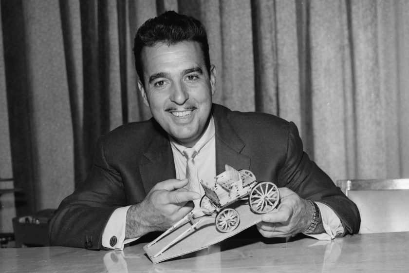 (Original Caption) Tennessee Ernie Ford proudly displays the matchstick wagon which was made by an inmate of the Marquette Prison especially for Ford whose CBS-Radio program is a favorite at the penal institution. The inmate claims he spent six months working on the project, using nothing but matches.