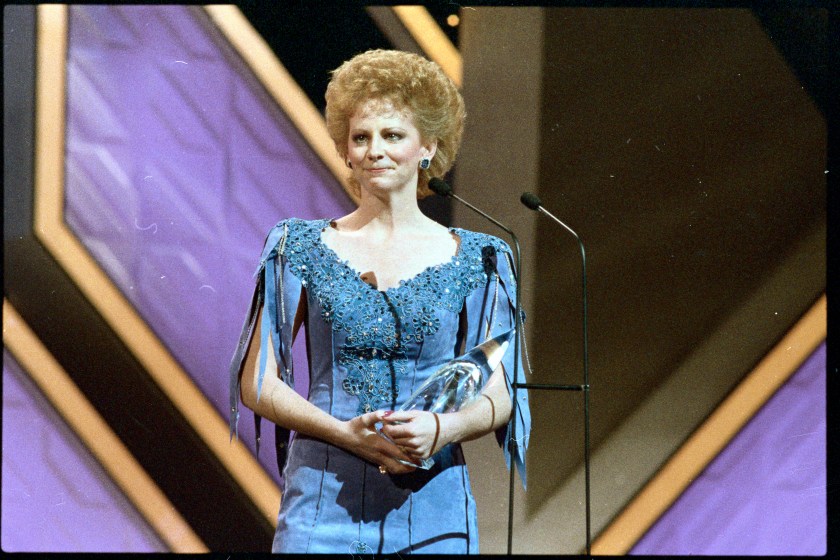 (Original Caption) Nashville, Tenn.: Reba McEntire tearfully accepts the award for "Entertainer of the Year" during Country Music Association awards presentations 10/13 night.
