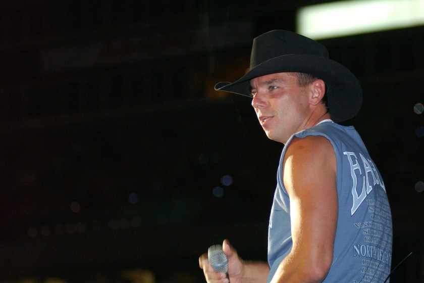 NASHVILLE, TN - JUNE 13: Kenny Chesney performs June 13, 2002 at the 31st Annual Fan Fair in Nashville, Tennessee. The four-day event is billed as the world's largest country music festival and features concerts, fan club parties and opportunities to meet the stars.