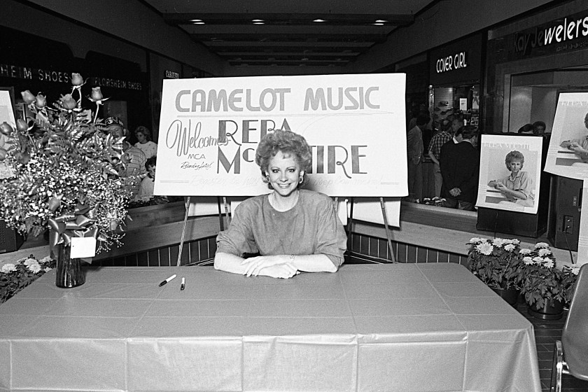 NASHVILLE - OCTOBER 2: Country Music Singer Reba McEntire waits to sign autographs at the Camalot Music Store in Rivergate Mall in October 02, 1986 Nashville ,Tennessee.