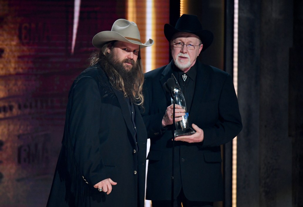 NASHVILLE, TN - NOVEMBER 14: (FOR EDITORIAL USE ONLY) Chris Stapleton and Mike Henderson accept an award onstage during the 52nd annual CMA Awards at the Bridgestone Arena on November 14, 2018 in Nashville, Tennessee.