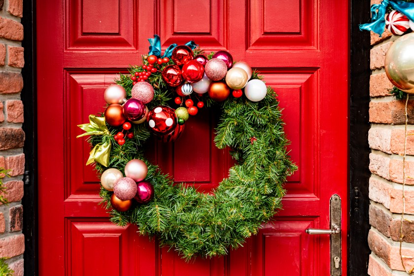 Waiting for Christmas - Red Wooden Front Door Decorated with Wreath, Garlands, Dwarfs, Gifts,...