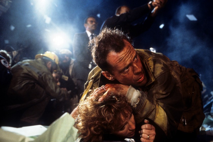 Bonnie Bedelia is held down by Bruce Willis in a scene from the film 'Die Hard', 1988.