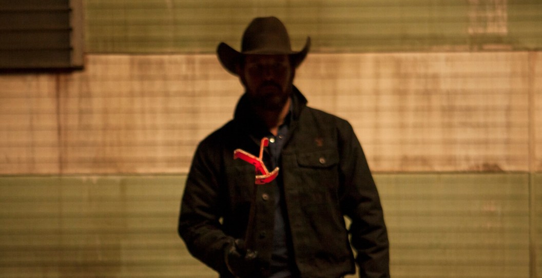 Cole Hauser as Rip Wheeler holding the brand in Yellowstone