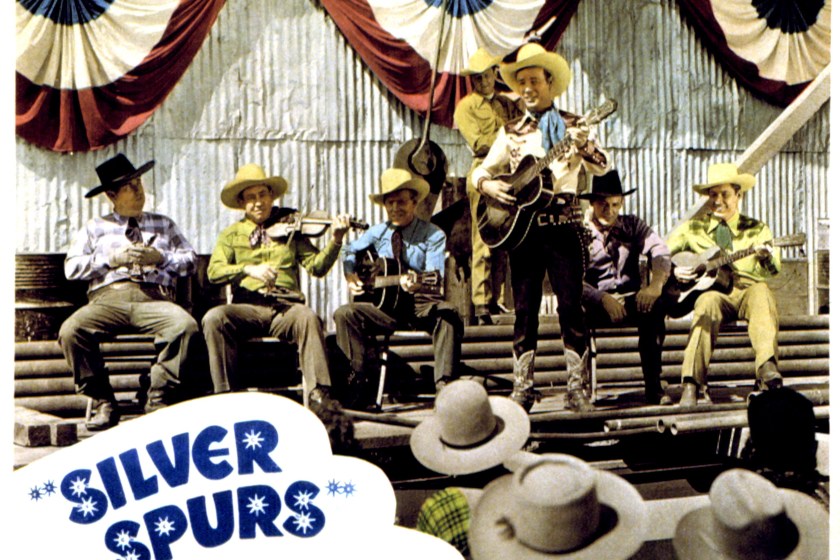 Silver Spurs, lobbycard, Roy Rogers (standing) and the Sons of the Pioneers, 1943.