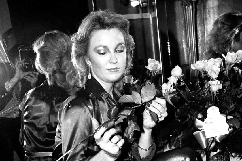 Portrait of American Country musician Tanya Tucker, a bouquet roses in her hands, as she poses backstage prior to a performance at the Bottom Line, New York, New York, December 13, 1987. Tucker was performing in support of her 'TNT' album. 