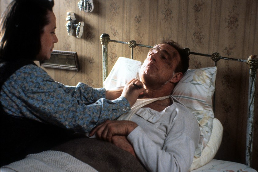 Kathy Bates watches over James Caan in a scene from the film 'Misery', 1990.