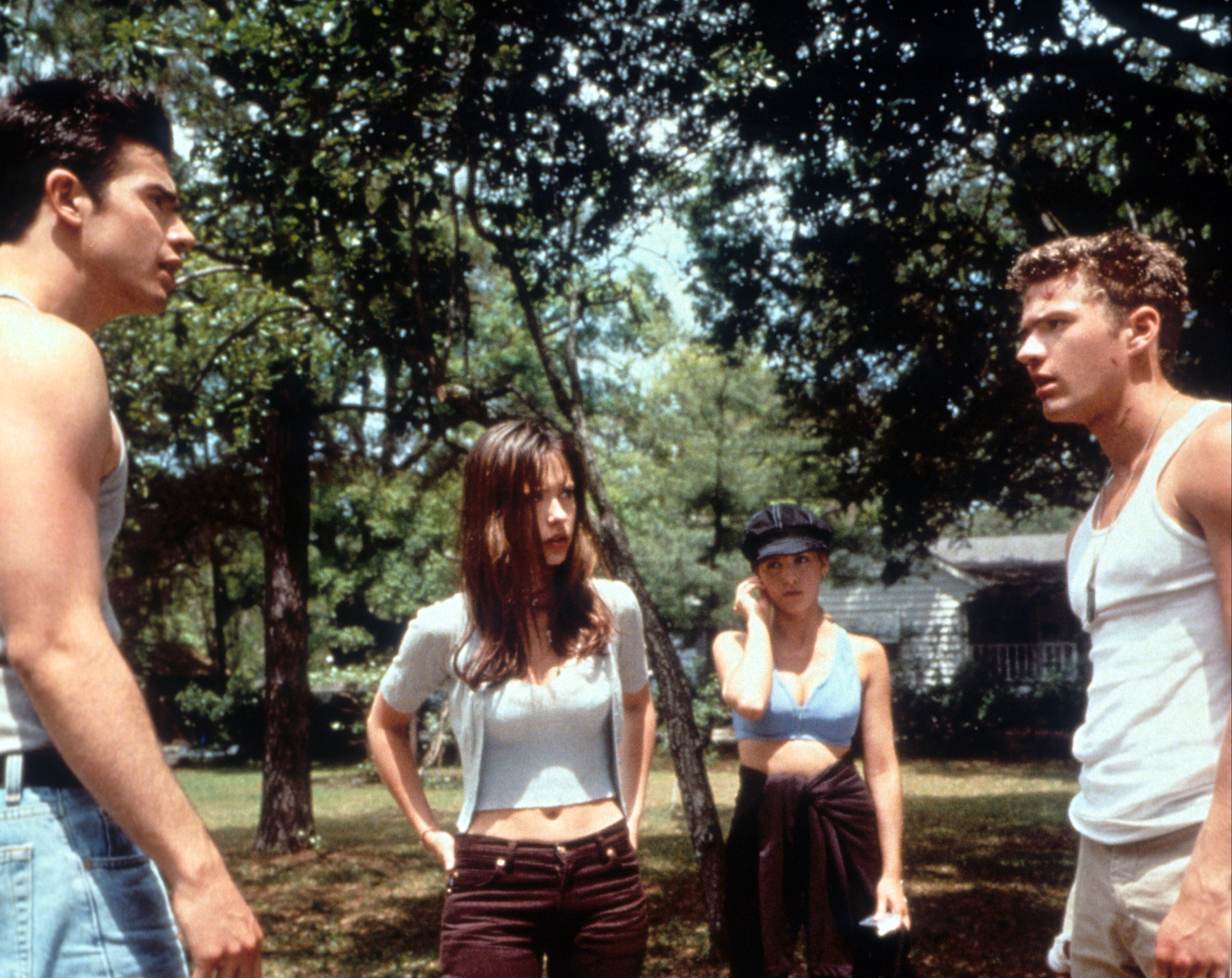 Freddie Prinze Jr having a confrontation with a man as Jennifer Love Hewitt watches in a scene from the film 'I Know What You Did Last Summer',. 