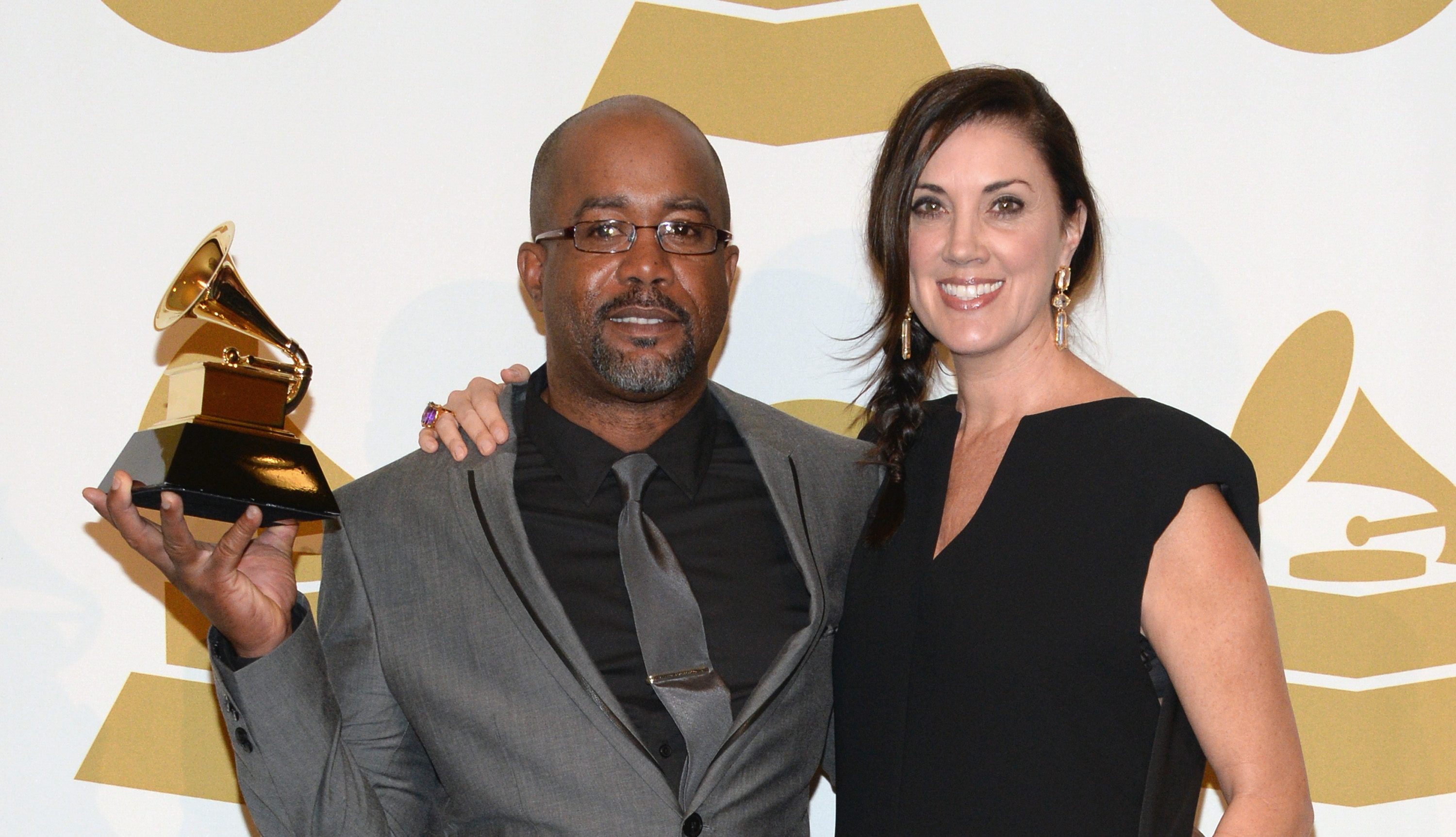 LOS ANGELES, CA - JANUARY 26: Recording artist Darius Rucker (L) and Beth Leonard pose in the press room during the 56th GRAMMY Awards at Staples Center on January 26, 2014 in Los Angeles, California.