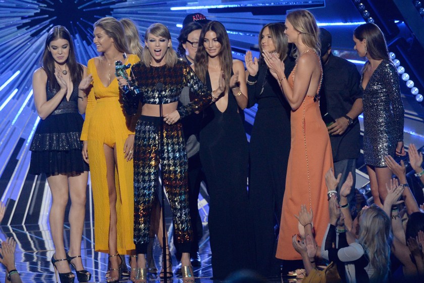 LOS ANGELES, CA - AUGUST 30: (L-R) Model Martha Hunt, actress Hailee Steinfeld, model Gigi Hadid, actress Serayah, recording artist Taylor Swift, director Joseph Kahn, model Lily Aldridge, actress Mariska Hargitay and model Karlie Kloss onstage during the 2015 MTV Video Music Awards at Microsoft Theater on August 30, 2015 in Los Angeles, California.
