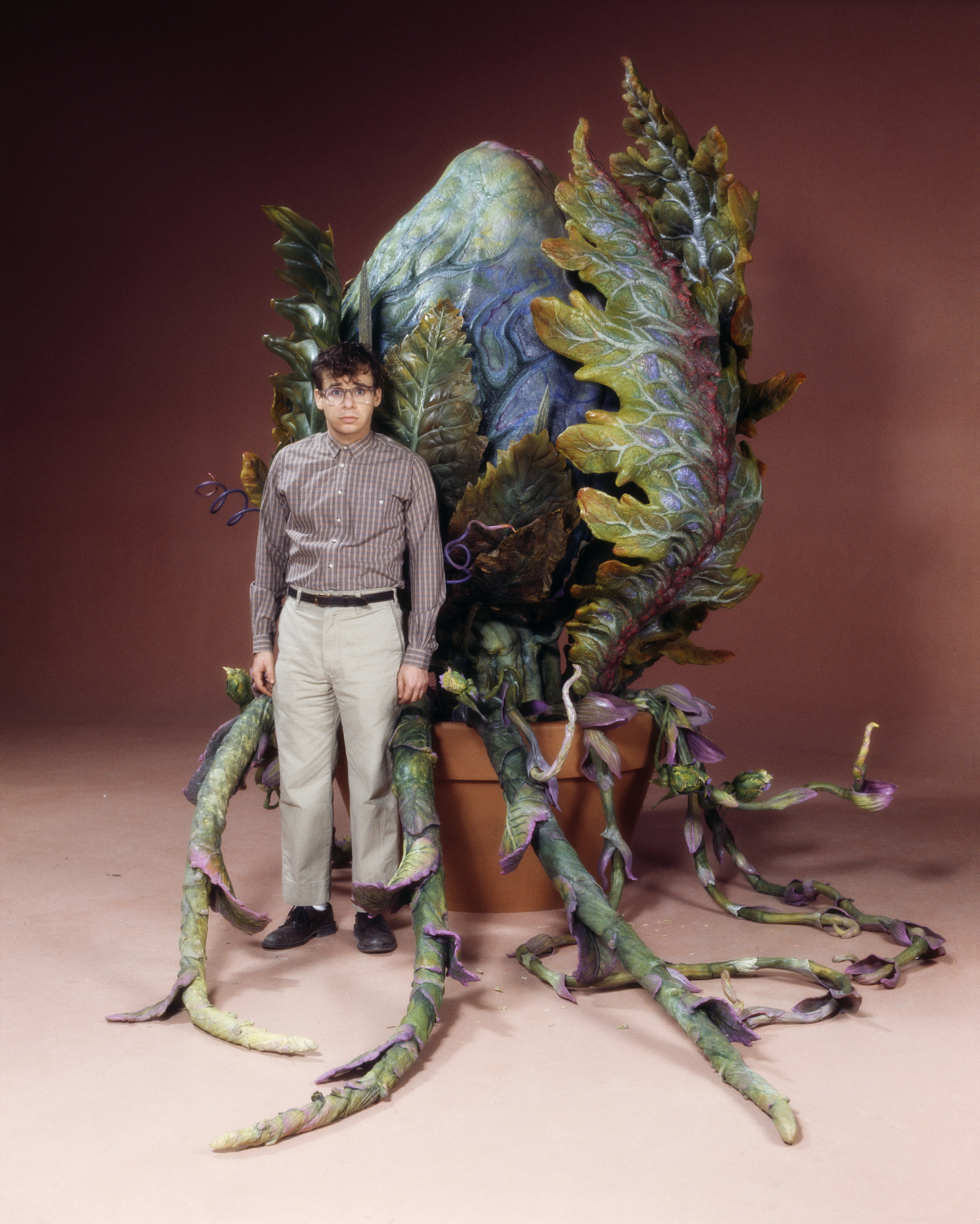 Actor Rick Moranis with the plant Audrey II of the film Little Shop of Horrors.