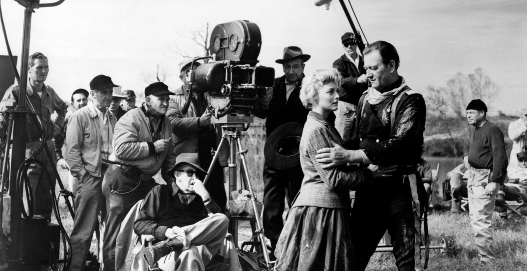 American actors Constance Towers and John Wayne with director John Ford on the set of his movie The Horse Soldiers
