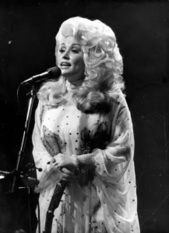 NEW YORK - CIRCA 1977: Dolly Parton in concert circa 1977 in in New York City.