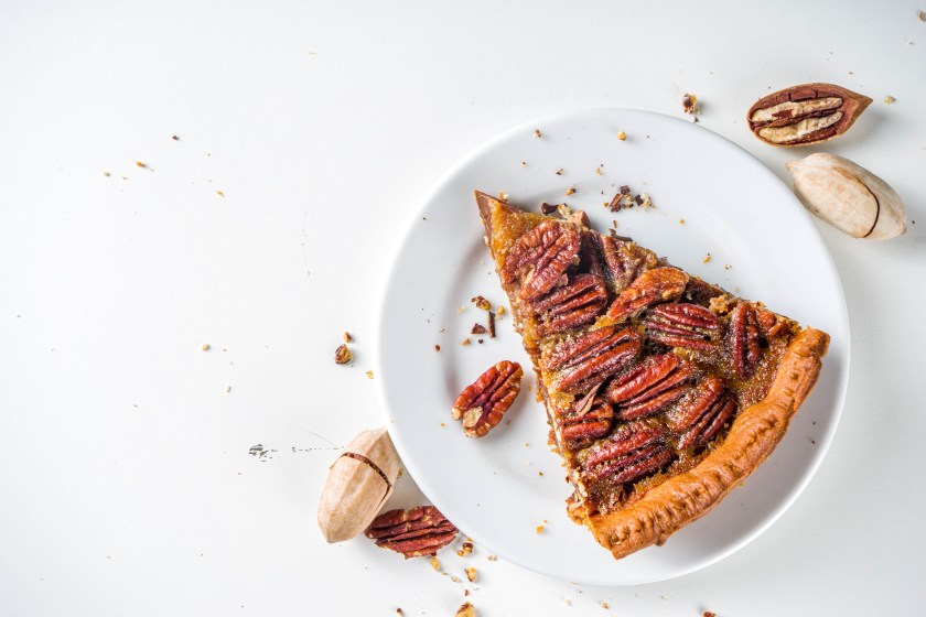 Homemade autumn pecan pie on white background, Traditional fall and winter, thanksgiving american nut cake,