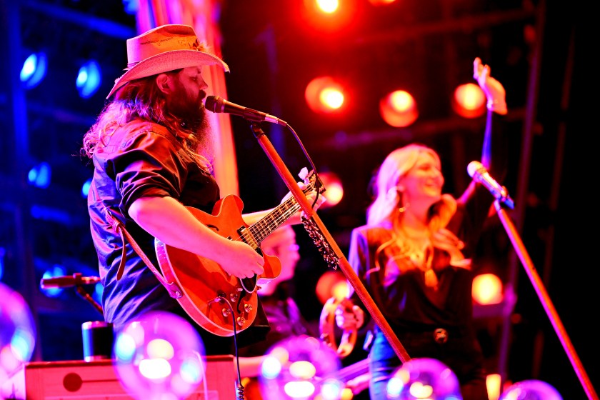 ATLANTA, GEORGIA - NOVEMBER 12: Chris Stapleton and Morgane Stapleton perform onstage during ATLive 2022 at Mercedes-Benz Stadium on November 12, 2022 in Atlanta, Georgia.