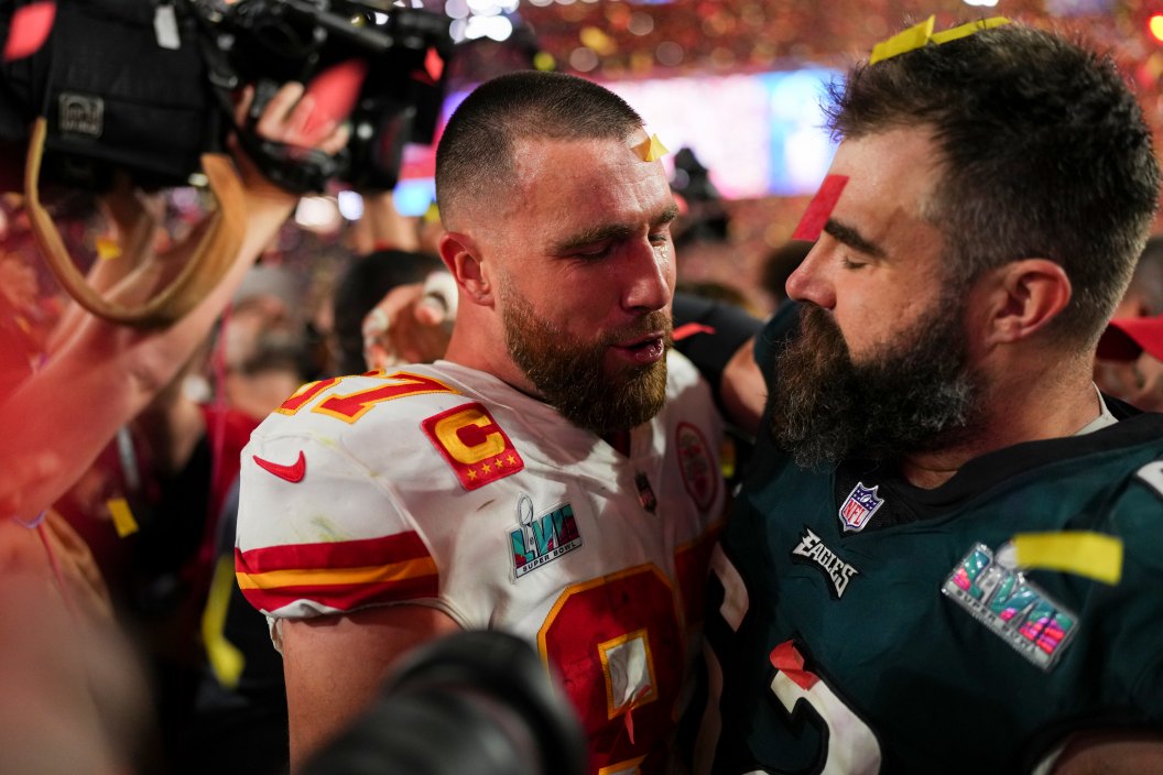 GLENDALE, AZ - FEBRUARY 12: Travis Kelce #87 of the Kansas City Chiefs speaks with Jason Kelce #62 of the Philadelphia Eagles after Super Bowl LVII at State Farm Stadium on February 12, 2023 in Glendale, Arizona. The Chiefs defeated the Eagles 38-35.