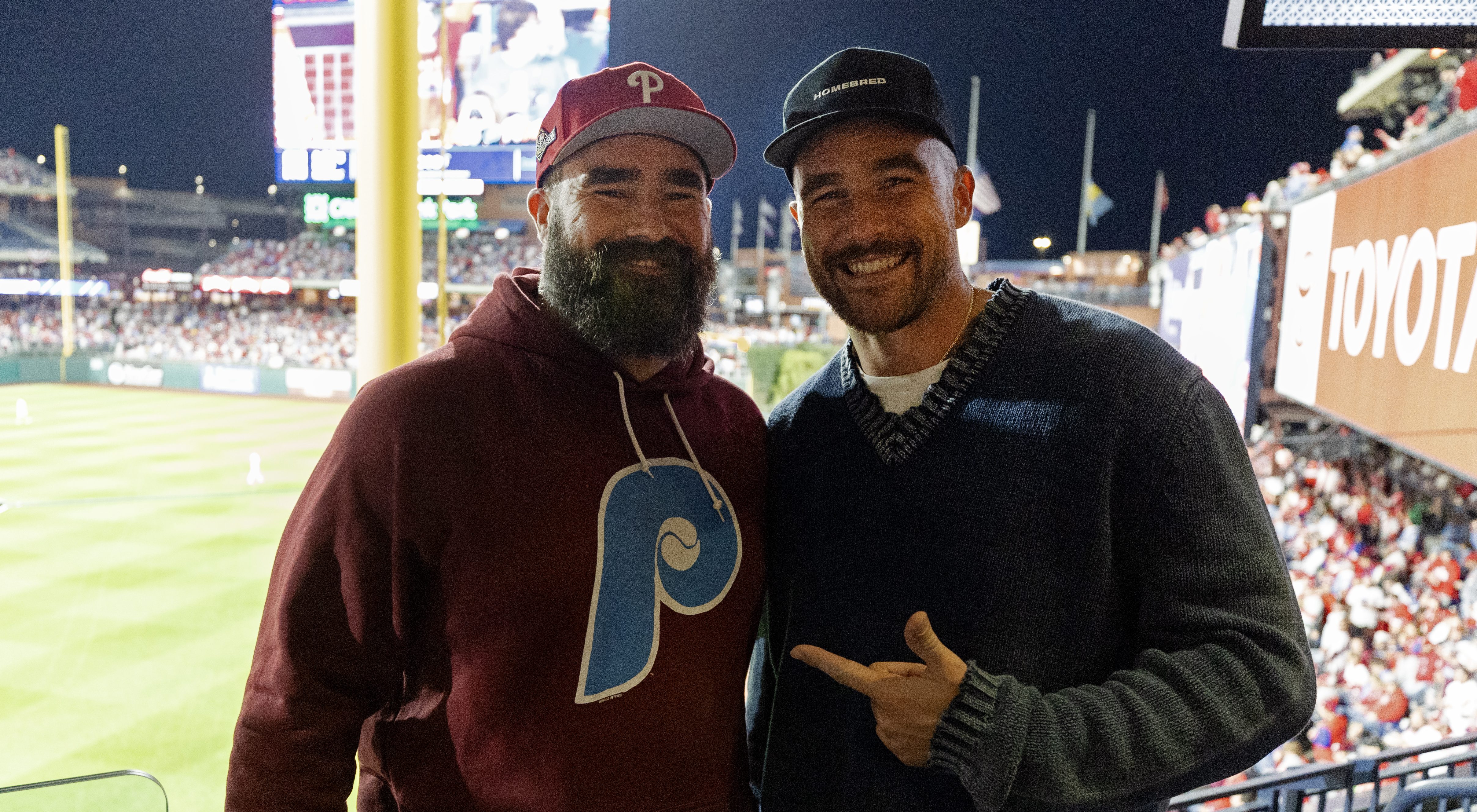 PHILADELPHIA, PA - OCTOBER 16: Jason and Travis Kelce pose for a photo during Game 1 of the NLCS between the Arizona Diamondbacks and the Philadelphia Phillies at Citizens Bank Park on Monday, October 16, 2023 in Philadelphia, Pennsylvania.
