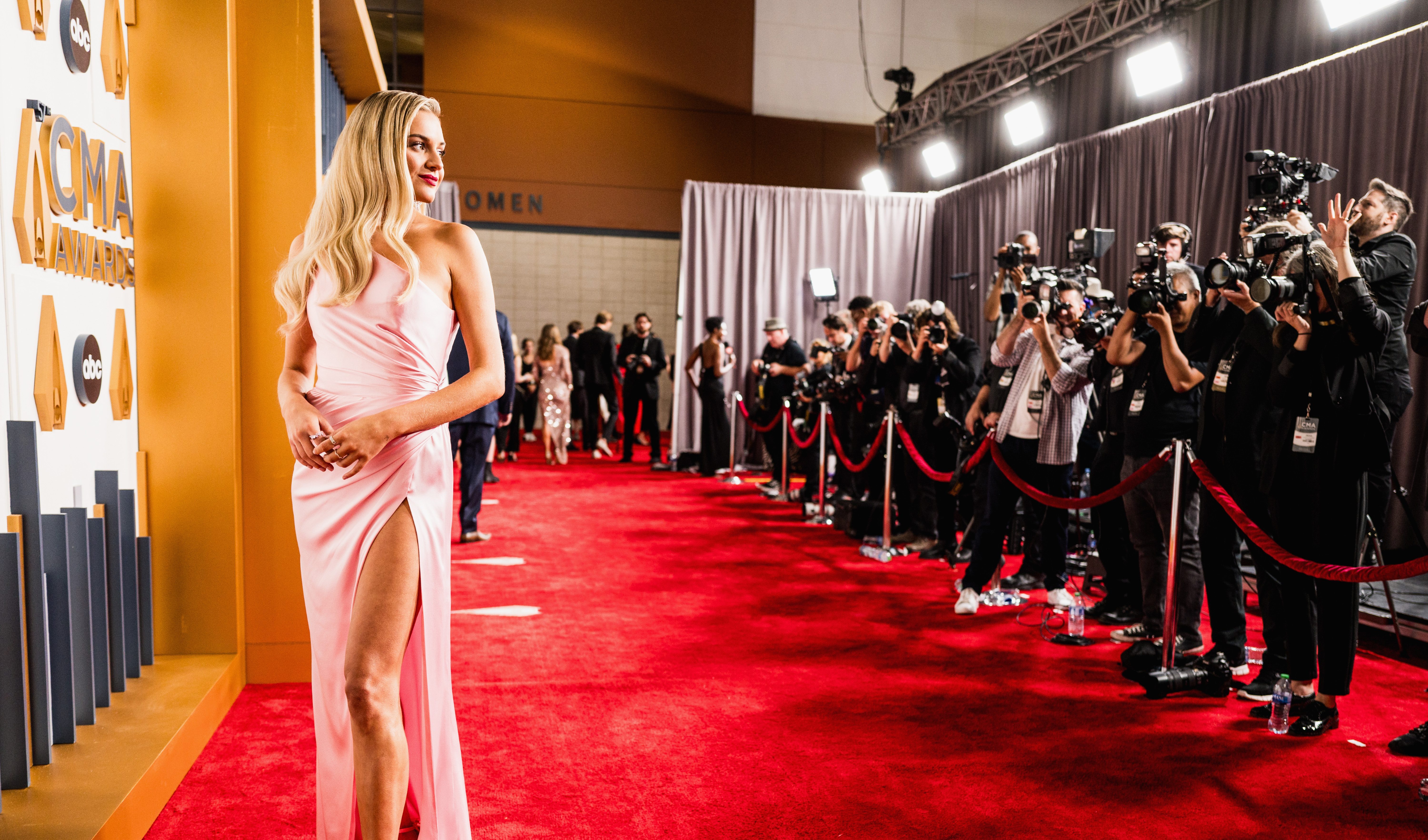 cma red carpet dresses Kelsea Ballerini Swaps Sheer Red Dress for Hooded Gown With Plunging Neckline