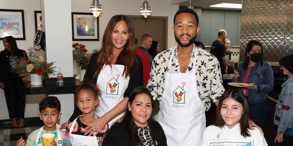 LOS ANGELES, CALIFORNIA - NOVEMBER 12: Chrissy Teigen (L) with son Miles, daughter Luna and John Legend (R) visit families at Ronald McDonald House Charities (RMHC) For The Season Of Giving at Ronald McDonald House Charities on November 12, 2023 in Los Angeles, California.