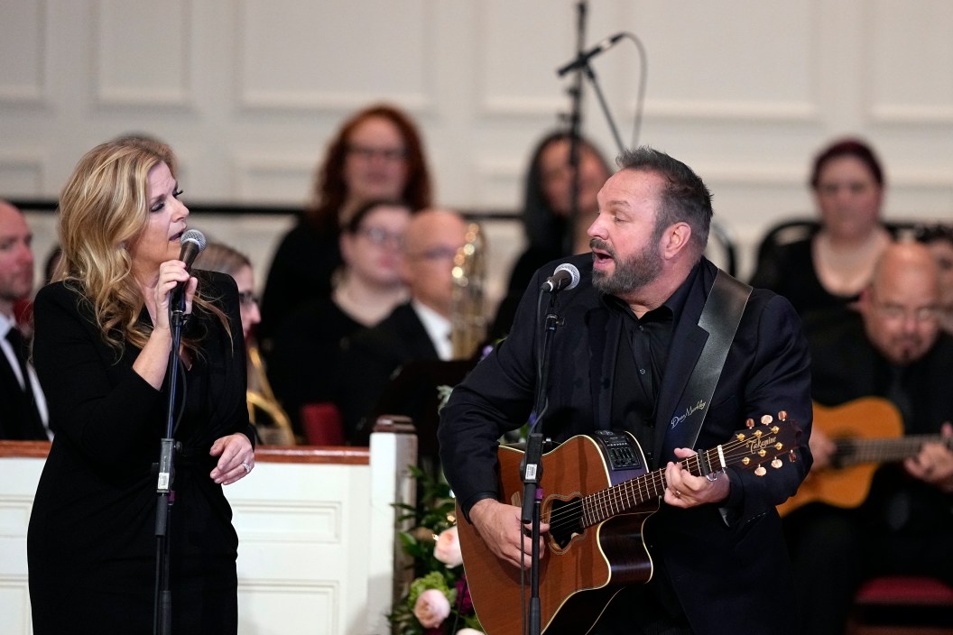 ATLANTA, GEORGIA - NOVEMBER 28: Trisha Yearwood and Garth Brooks perform "Imagine" at a tribute service for former first lady Rosalynn Carter at Glenn Memorial United Methodist Church at Emory University on November 28, 2023 in Atlanta, Georgia. Rosalynn Carter, who passed away on November 19 at the age of 96, was married to former U.S. President Jimmy Carter for 77 years. In her lifetime she was an activist and writer known to be an advocate for the elderly, affordable housing, mental health, and the protection of monarch butterflies. President Joe Biden, former President Jimmy Carter and every living first lady are attending the service.